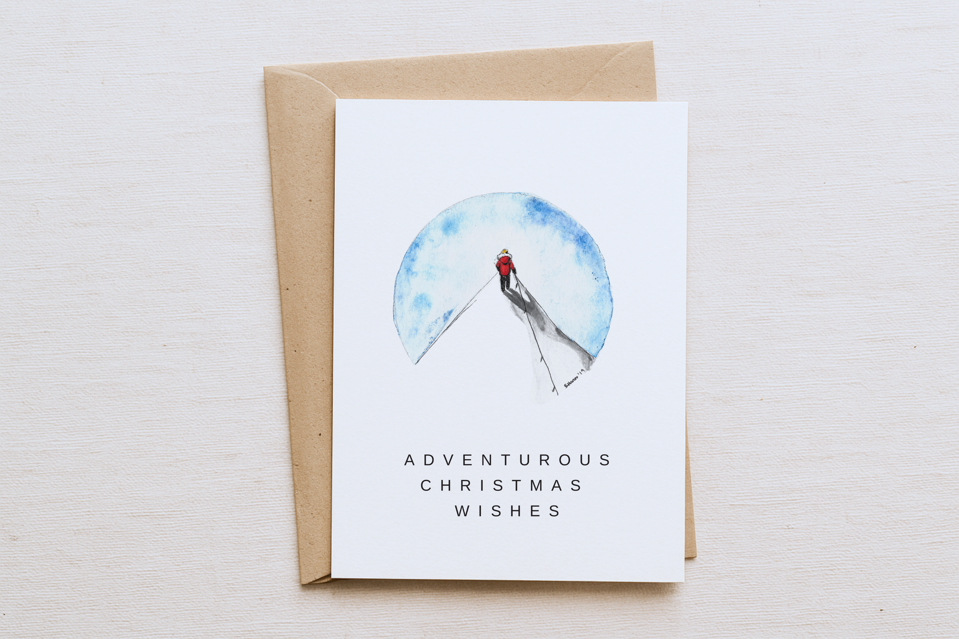 Adventurous Christmas Card – Man on Top of Mountain