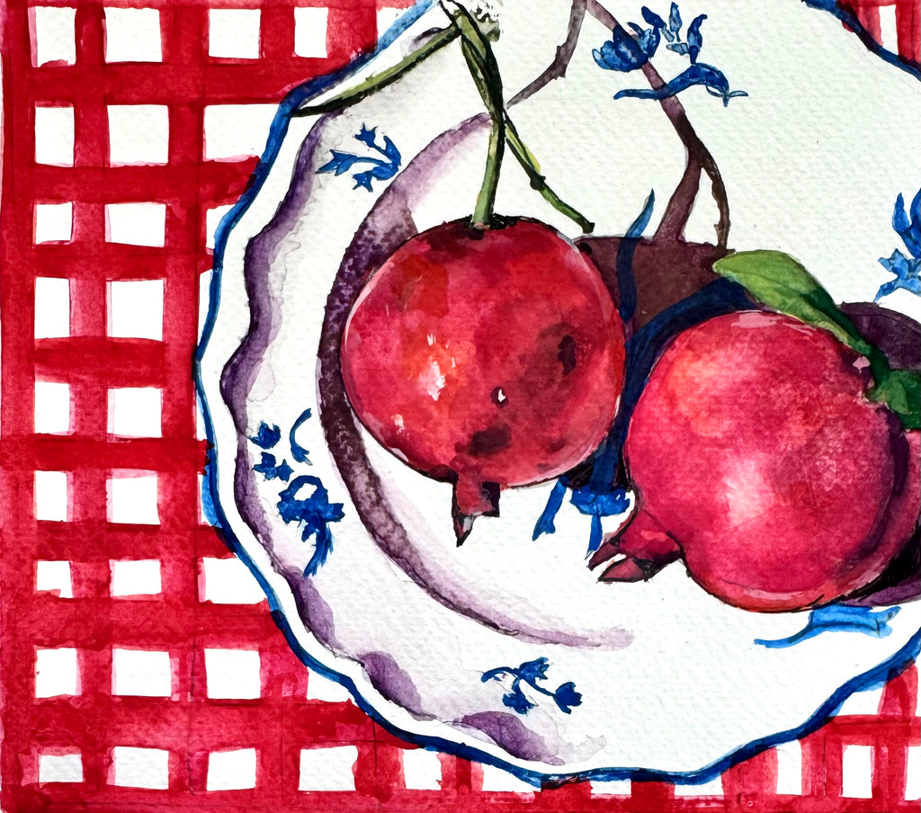 Detail of “Seeds of Hope” watercolour showing gentle red washes and loose brushwork on pomegranate forms.